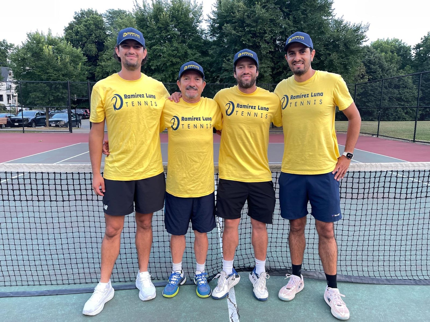 The Ramirez Luna Tennis coaching team: Felipe, Alberto, Juan Camilo and Julian, left to right, in the academy’s navy-and-gold shirts.